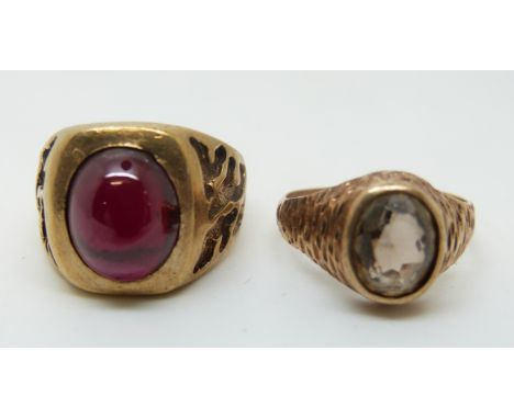 A 9ct gold ring set with a ruby cabochon (size N) and a 9ct gold ring set with a smoky quartz (size L), 12.1g