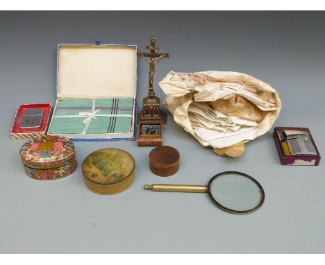 A boxed Ronson Standard lighter, a collection of lace and textiles, a brass crucifix, travelling clock, wooden box, magnifyin