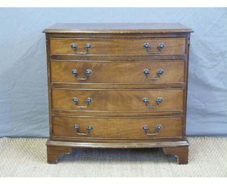 A small bow fronted graduated chest of four drawers, W76 x D49 x H74cm 