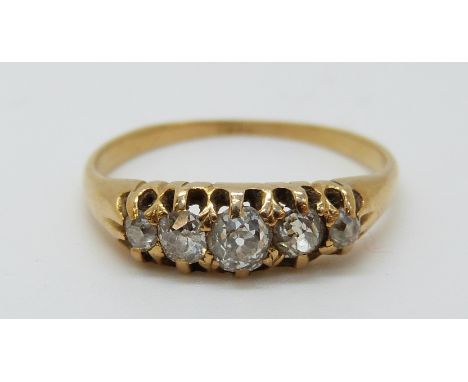 An 18ct gold ring set with five old cut diamonds (size M) 