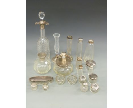 A large collection of hallmarked silver mounted glass items comprising cut glass decanter, marks rubbed but early 20thC, thre