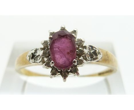 A 9ct gold ring set with a ruby and diamonds, size T, 1.92g