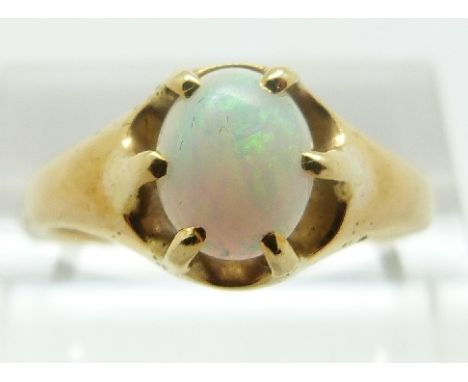 A yellow metal ring set with an oval opal cabochon, size P, 4.08g 