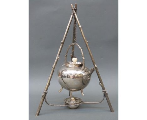 A plated spirit kettle with unusual three-branch tripod stand