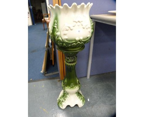 Green glazed ceramic jardinière on stand.