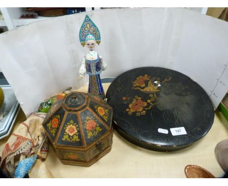 Japanese ceramic lazy susan in lacquer case, eastern-style dolls and other dolls, papier mâché box and cover.
