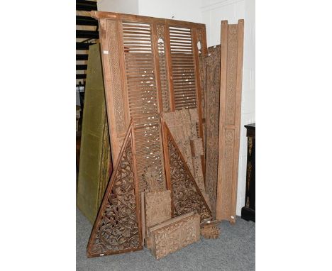 A quantity of early 20th century South East Asian panels, profusely carved with stylised flowers and foliate scrolls, the lar
