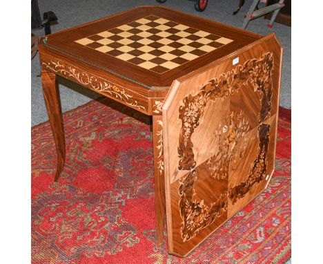 A 20th century Italian marquetry games table, incorporating tables for backgammon, chess, and cards, with a roulette wheel an