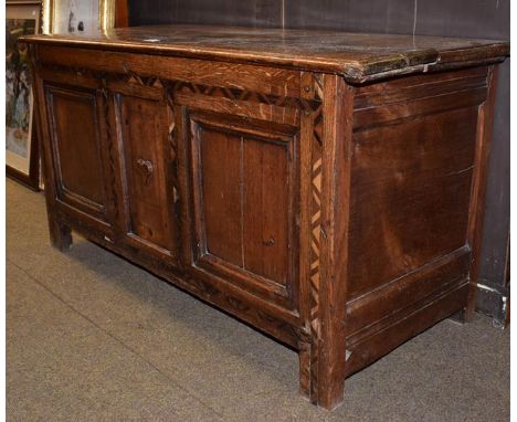 An 18th century parquetry inlaid three panel oak marriage chest, 124cm by 49cm by 63cm  