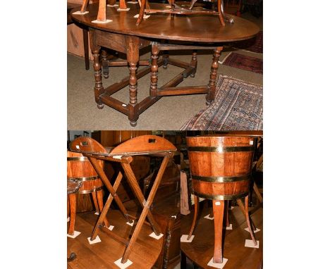A coopered oak planter on stand, 45cm diameter by 77cm, together with an oak butlers tray on stand, 89cm by 66cm open by 80cm