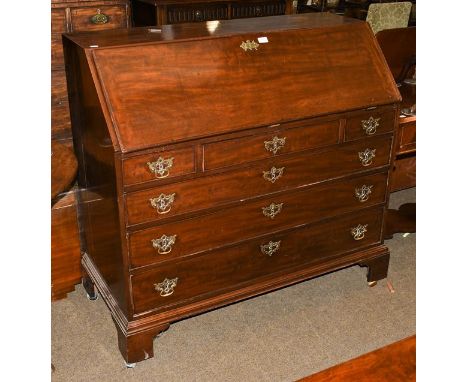 A George III mahogany bureau with fitted interior and raise don bracket feet, 115cm by 63cm by 113cm