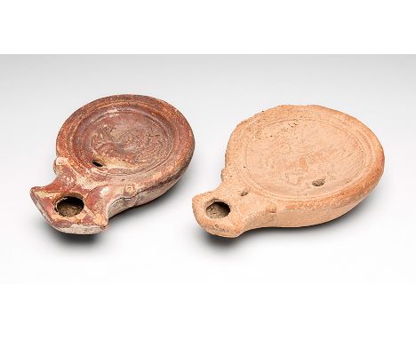 Pair of skylights, 1st-2nd century AD.Terracotta.Measurements: 10 x 7 x 2 cm and 9 x 6 x 2,5 cm.One of the skylights contains