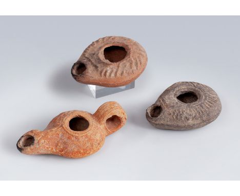 Three Roman skylights, 2nd-3rd century AD.In terracotta.Measurements: 2,5 x 7,5 x 6 cm; 3 x 10,5 x 5,6 and 2,5 x 7,5 x 5,5 cm