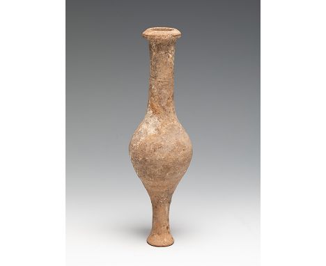 Roman ointment. I-III Century A.D.Terracotta.Measurements: 19 x 6 cm .Terracotta vessel with globular body and neck. This typ