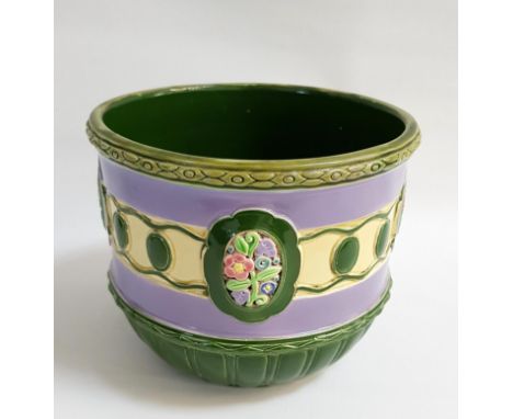 EICHWALD POTTERY JARDINIEREwith a green interior, the violet exterior with a cream band with green button decoration and flor