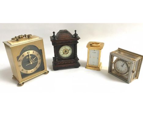 SELECTION OF FOUR CLOCKScomprising of a small mahogany clock with circular enameled dial, two brass carriage clocks and a des