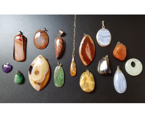 GOOD SELECTION OF AGATE AND HARDSTONE PENDANTSincluding one on fine nine carat gold chain, another with silver mount, and a l