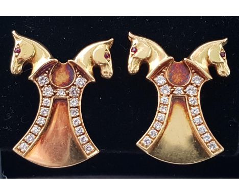 PAIR OF EQUESTRIAN INTEREST DIAMOND AND RUBY EARRINGSin eighteen carat gold, the double horse heads on each with ruby eyes, a