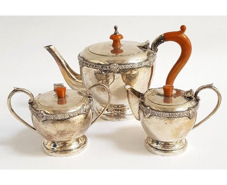 SILVER BACHELOR'S TEA SERVICEcirca 1930s, comprising tea pot, sugar basin and milk jug, all with decorative edge rims and hin