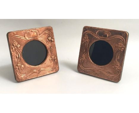 PAIR OF ART NOUVEAU STYLE COPPER PHOTOGRAPH FRAMESthe square frames with relief scroll and tendril decoration, on easel suppo