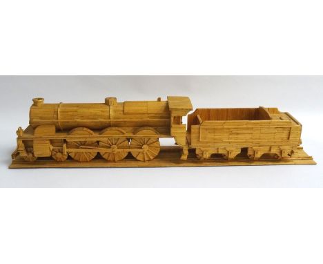MATCHSTICK MODEL OF A STEAM ENGINE LOCOMOTIVE AND TENDERon a section of matchstick track, 58.5cm long 