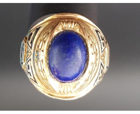 TEN CARAT GOLD JOSTEN AMERICAN COLLEGE RINGthe central oval blue cabochon stone flanked by J, 1 and 9 to one shoulder and 6, 