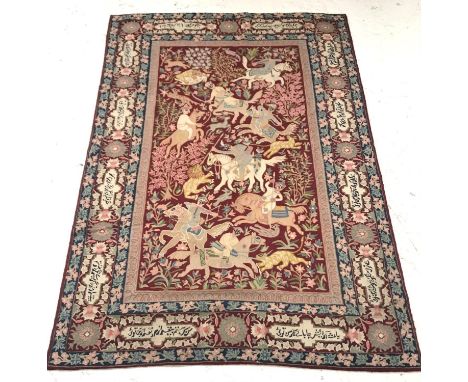 PERSIAN RUG/WALL HANGINGwith a claret ground decorated with men on horseback hunting wild animals with swords, spears, bows a