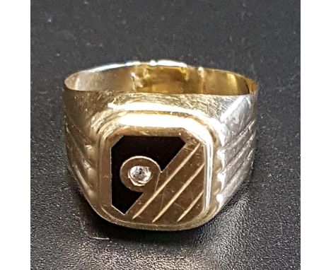 FOURTEEN CARAT GOLD SIGNET RINGdecorated with CZ and black enamel, ring size R-S and approximately 3.9 grams 