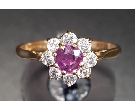 RUBY AND CZ CLUSTER RINGon nine carat gold shank, ring size M-N 