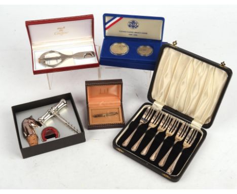 Cased set of six silver cake forks, Cartier cigar cutter, boxed, cased set United States Liberty Coins, boxed, silver extendi