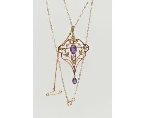 A BOXED YELLOW METAL EDWARDIAN LAVALIER PENDANT NECKLACE, open work floral detailed lavalier pendant, set with a central, ova