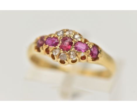 AN EARLY 20TH CENTURY RUBY AND DIAMOND RING, comprised of three oval cut rubies, two circular cut rubies and six rose cut dia