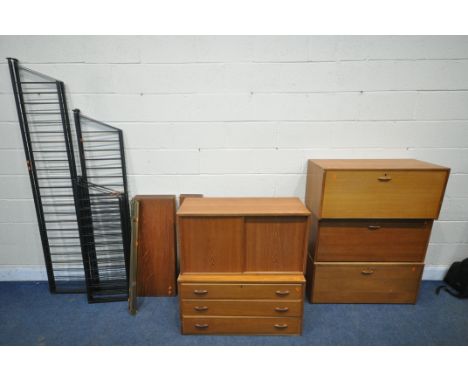 A MID CENTURY TEAK STAPLES LADDERAX CORNER MODULAR SHELVING UNIT, comprising three various fall front sections, one containin