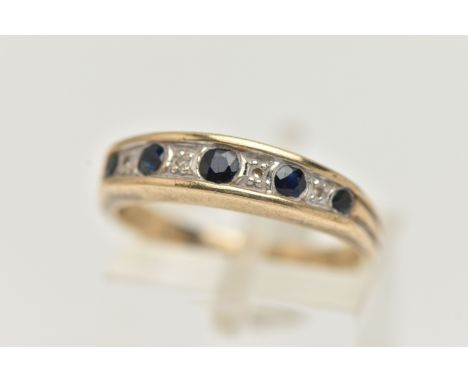 A 9CT GOLD SAPPHIRE AND DIAMOND HALF ETERNITY RING, designed with a row of five graduated circular cut blue sapphires, inters