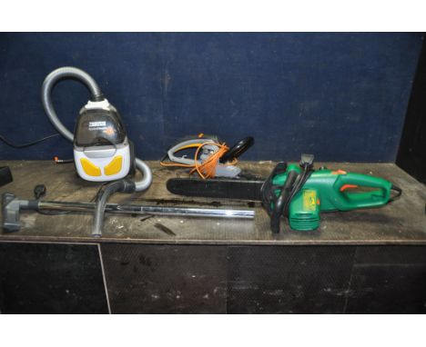 A ZANUSSI CYCLONE CLASSIC VACUUM CLEANER, a Black and Decker electric chainsaw and a Titan electric hedge trimmer (all PAT pa