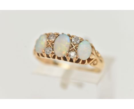 AN EARLY 20TH CENTURY, 18CT GOLD OPAL AND DIAMOND RING, designed with three oval opal cabochons, interspaced with four small 