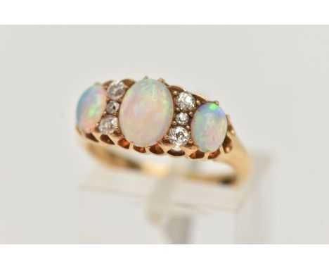 AN EARLY 20TH CENTURY OPAL AND DIAMOND RING, three oval cabochon opals prong set in yellow metal, interspaced with six old cu