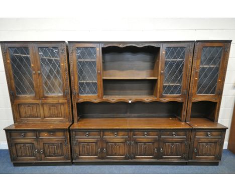 A JAYCEE OAK FOUR SECTION WALL CABINET, comprising a dresser, fitted with an arrangement of two lead glazed doors, four doors