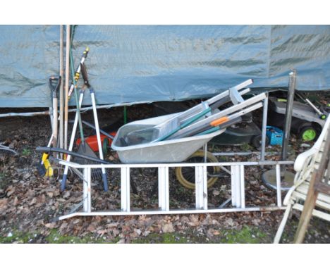A BUILDERS WHEELBARROW, two aluminium step ladders, and a quantity of garden tools (12+)