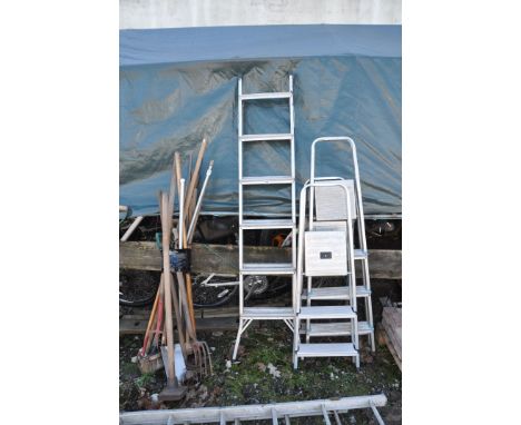 FOUR ALUMINIUM STEP LADDERS and some garden tools