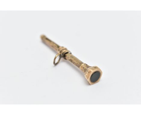 A YELLOW METAL RETRACTABLE PENCIL, small hexagonal shape pencil with floral pattern, set with a bloodstone terminal, fitted w