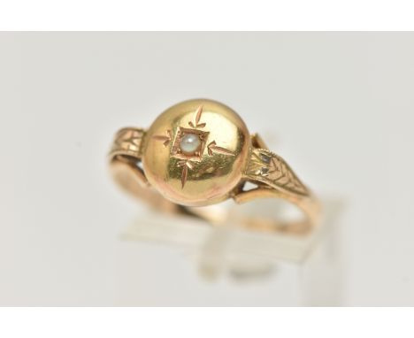A YELLOW METAL RING, possible conversion piece, domed ring set with a small seed pearl, scroll detailed trifurcated shoulders