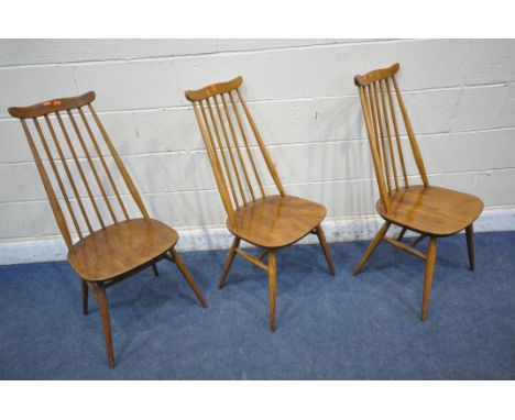 A SET OF THREE ERCOL ELM AND BEECH GOLDSMITH CHAIRS (condition report: frames with slight wobble, surface marks and scuffs, o