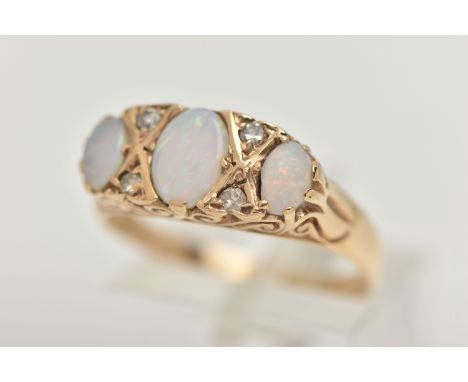 A YELLOW METAL OPAL AND DIAMOND RING, designed with three oval cut opals, interspaced with four small single cut diamonds, sc