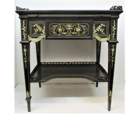 An Italian 19th century ivory inlaid ebony writing table, in the style of  Ferdinando Pogliani, the rectangular top centred w