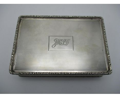 A George V silver cigarette box by William Base &amp; Sons, Birmingham 1928, of rectangular form with turned engine detail th