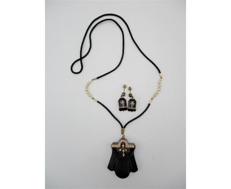 An Art Deco style jet, yellow metal and pearl parure, comprising a necklace and pair of earrings, the necklace with glazed ph