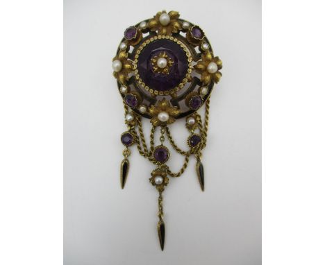 A Victorian yellow metal, enamel, amethyst and pearl brooch, of circular form with pierced yellow metal flowers to the border