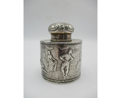 A late Victorian silver tea caddy by B Muller &amp; Son, Chester 1898, of circular form with embossed fresque around depictin