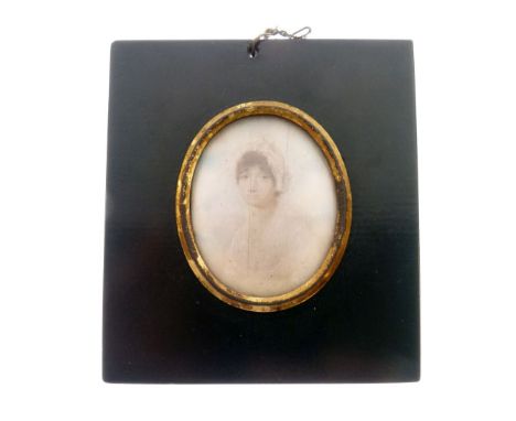 19th Century portrait on ivory - Lady in white lace bonnet, within a papier-mâché frame, the image measuring 55mm x 44mm  